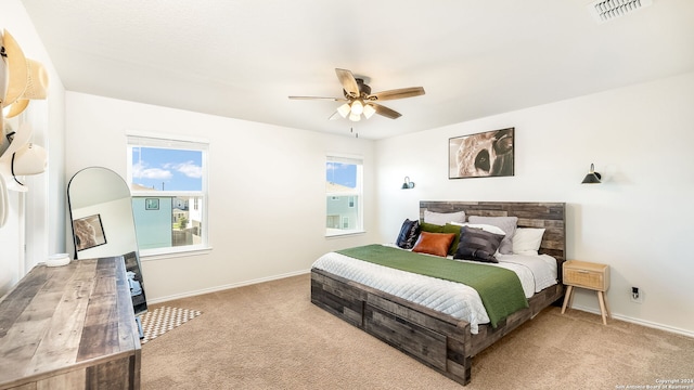 bedroom featuring ceiling fan and light colored carpet