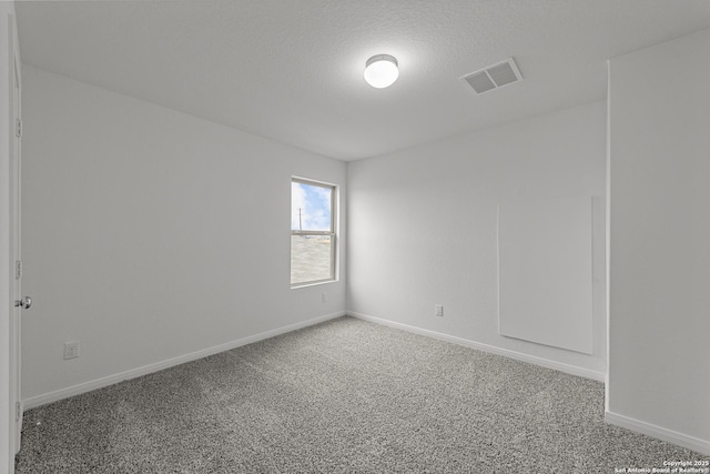 8432 Roadrunner Psge, San Antonio, TX 78222 - unfurnished room with visible vents, carpet floors, and baseboards