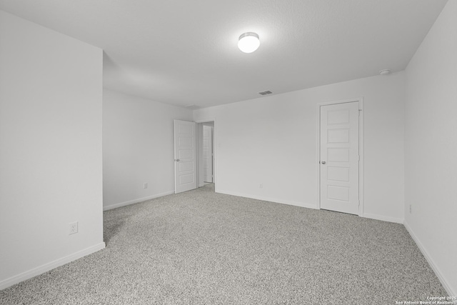 8432 Roadrunner Psge, San Antonio, TX 78222 - carpeted spare room featuring baseboards and visible vents