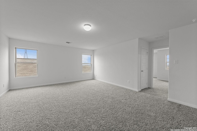 8432 Roadrunner Psge, San Antonio, TX 78222 - carpeted empty room with visible vents, a healthy amount of sunlight, and baseboards