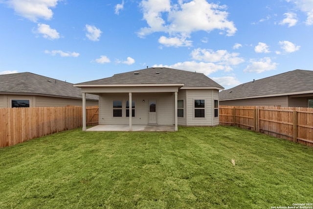 8432 Roadrunner Psge, San Antonio, TX 78222 - rear view of property with a lawn, a fenced backyard, and a patio area