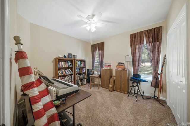 misc room featuring carpet and ceiling fan