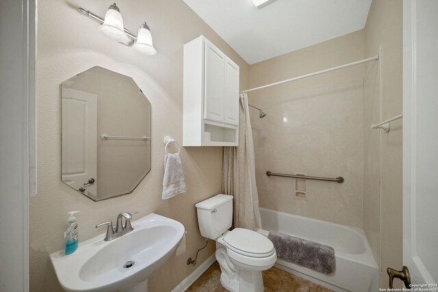 full bathroom with shower / bath combo, sink, and toilet