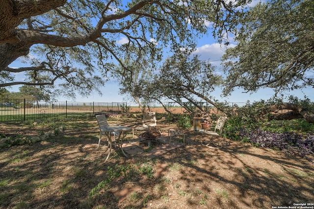 view of yard with a rural view