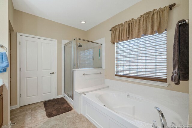 bathroom with vanity, separate shower and tub, and tile patterned flooring