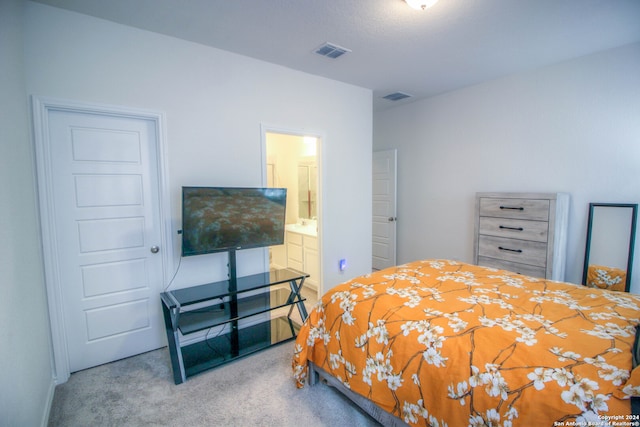 bedroom featuring carpet and connected bathroom