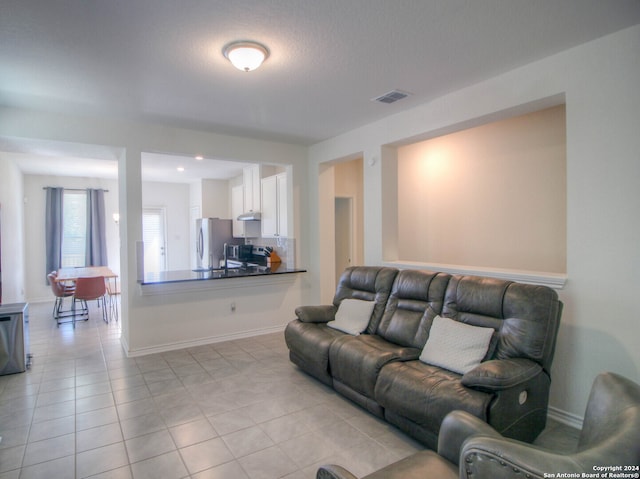 living room with light tile patterned floors