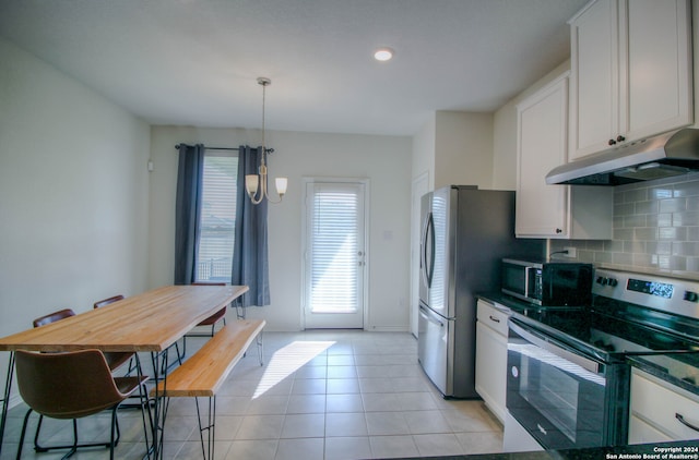 kitchen with pendant lighting, stainless steel appliances, white cabinetry, and an inviting chandelier