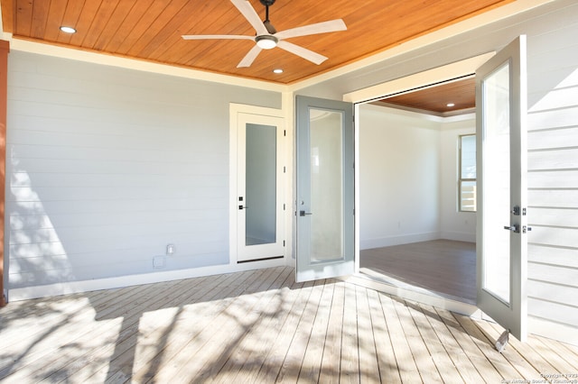 wooden deck featuring ceiling fan