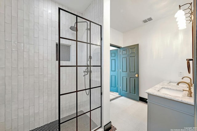 bathroom featuring vanity and a shower with shower door