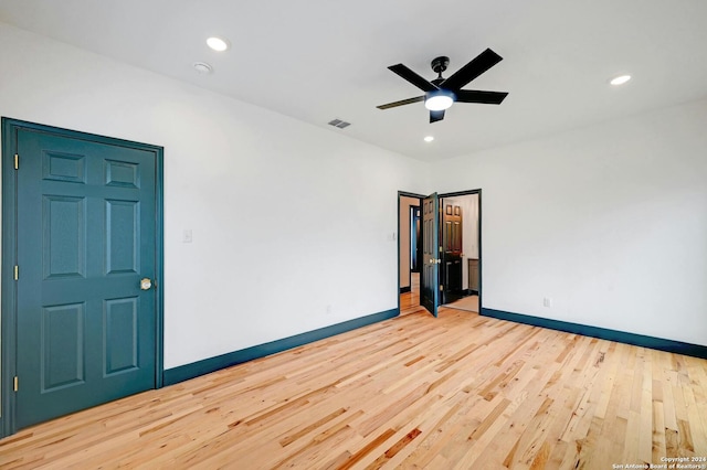 unfurnished room featuring light hardwood / wood-style flooring and ceiling fan