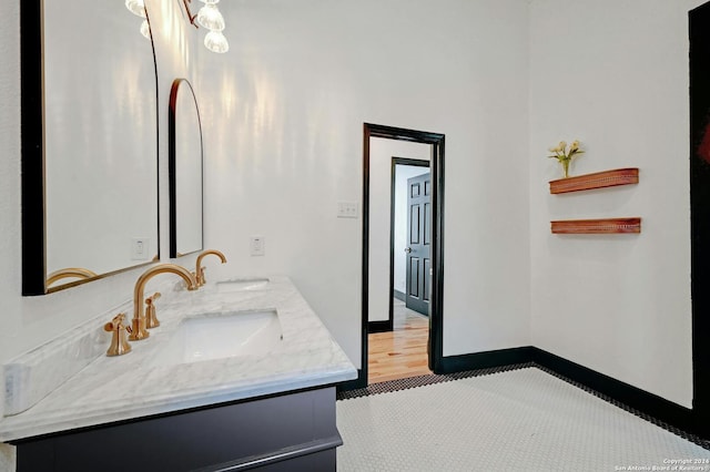 bathroom with vanity and hardwood / wood-style flooring