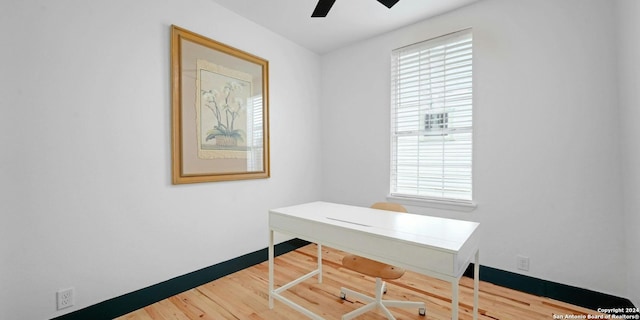 interior space with ceiling fan and hardwood / wood-style floors