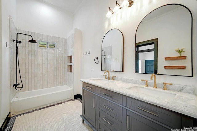 bathroom with vanity, tiled shower / bath combo, and tile patterned flooring