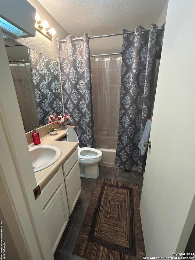 full bathroom with vanity, a textured ceiling, shower / bath combo, hardwood / wood-style floors, and toilet