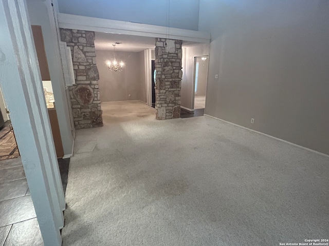 interior space with carpet floors and a chandelier