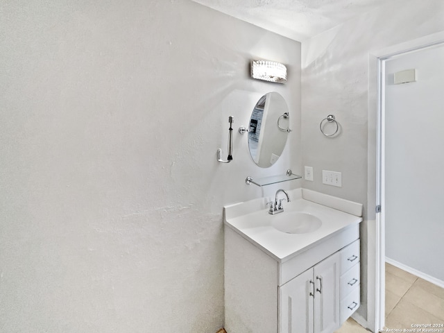 bathroom featuring tile patterned floors and vanity