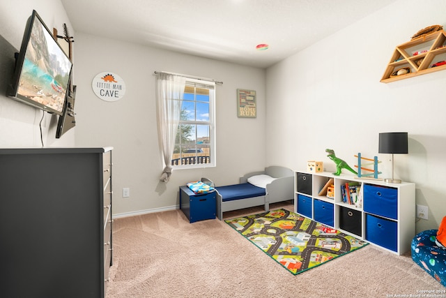 game room featuring light colored carpet