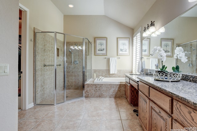 bathroom featuring lofted ceiling, plus walk in shower, tile patterned flooring, and vanity