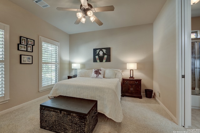 bedroom featuring ceiling fan and light carpet