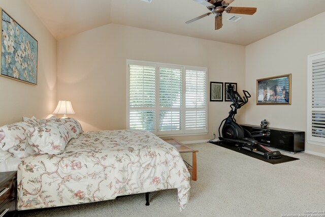 bedroom featuring ceiling fan, carpet floors, and vaulted ceiling