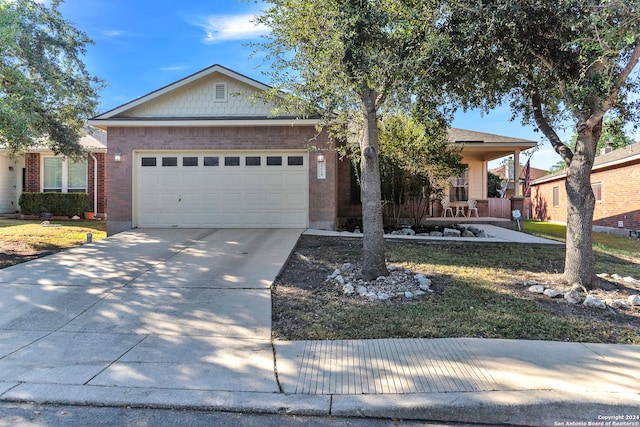 view of front facade with a front yard and a garage