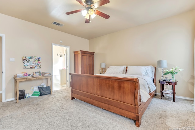 carpeted bedroom featuring ceiling fan and ensuite bathroom