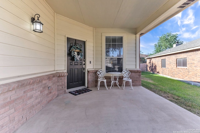 doorway to property with a patio area