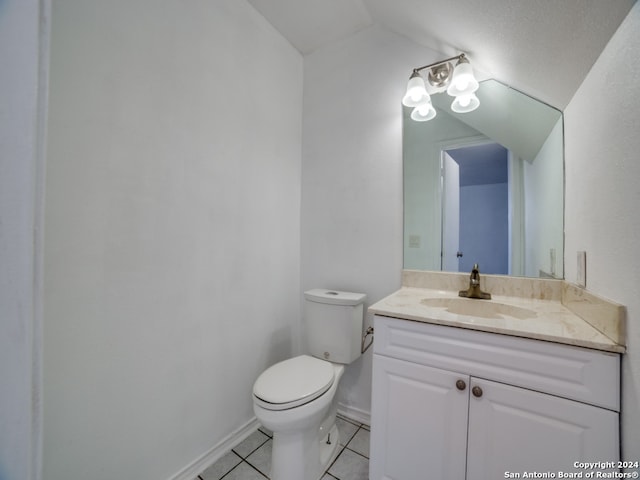 bathroom with tile patterned floors, vanity, and toilet