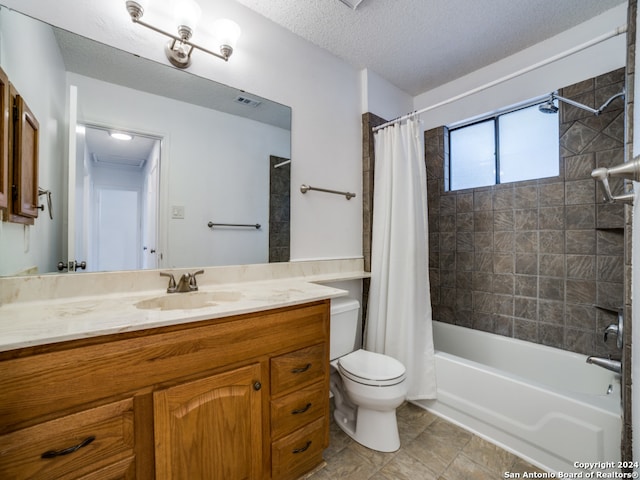 full bathroom featuring vanity, shower / bath combo, toilet, and a textured ceiling