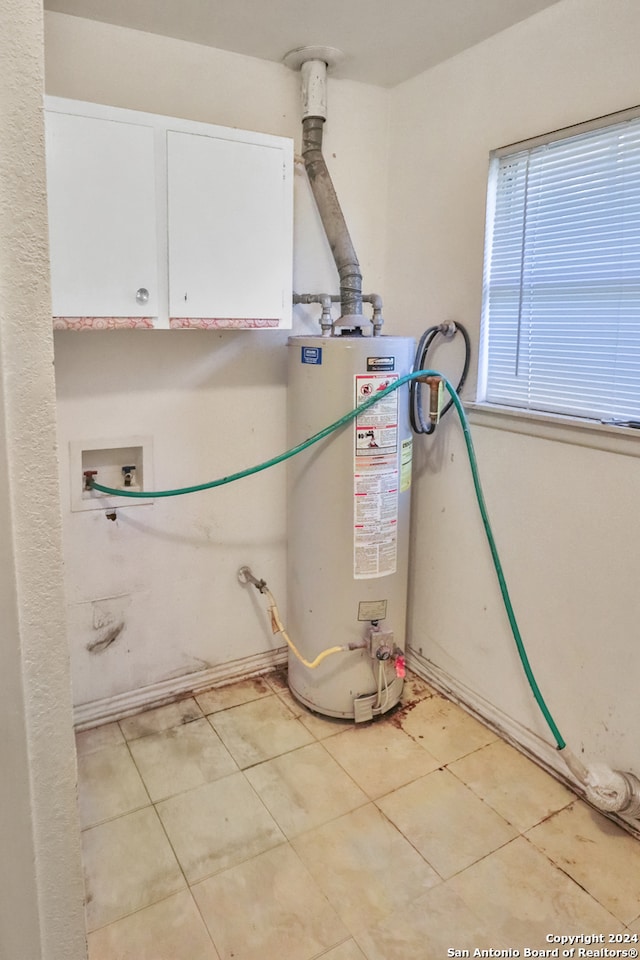 utility room with gas water heater