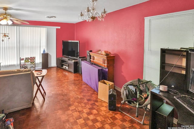 living room with ceiling fan with notable chandelier and parquet flooring