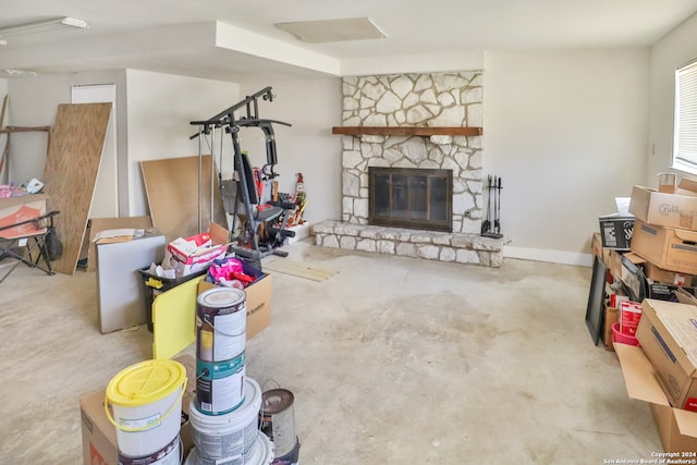 living room featuring a stone fireplace