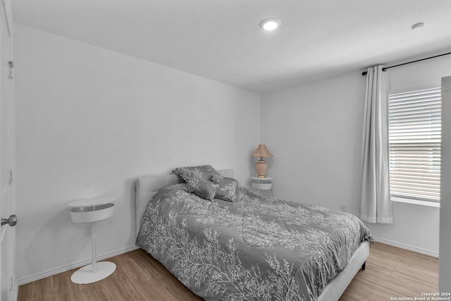 bedroom with wood-type flooring