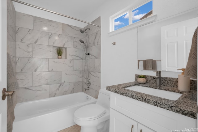 full bathroom featuring vanity, toilet, and tiled shower / bath