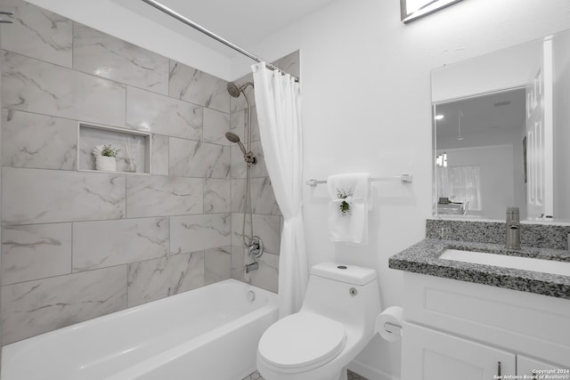 full bathroom featuring shower / bath combination with curtain, vanity, and toilet