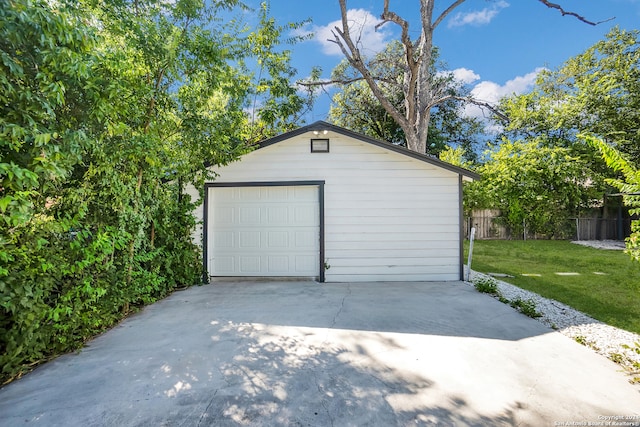 garage with a lawn