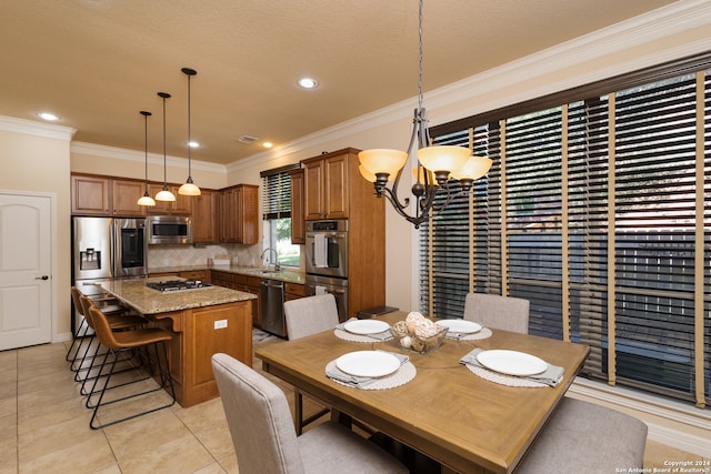 dining room with light tile patterned flooring, sink, a textured ceiling, an inviting chandelier, and crown molding