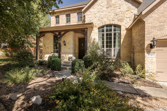 view of front of home with a garage and covered porch