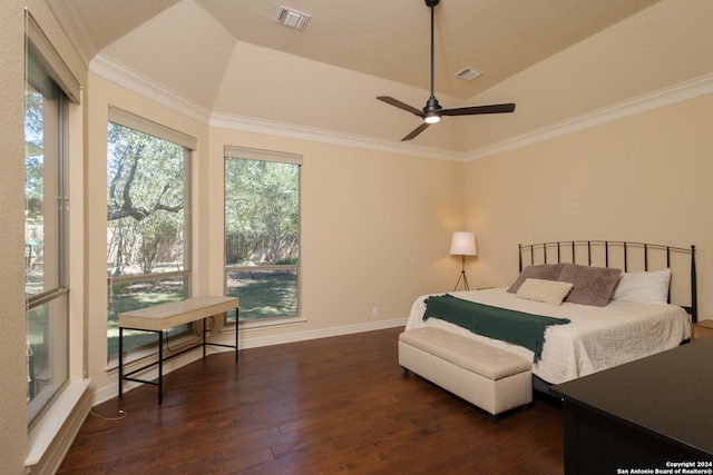 bedroom with ceiling fan, vaulted ceiling, ornamental molding, and dark hardwood / wood-style flooring