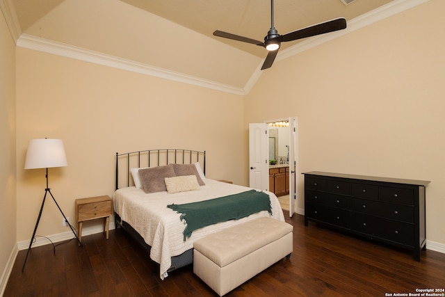 bedroom with crown molding, connected bathroom, dark wood-type flooring, and ceiling fan