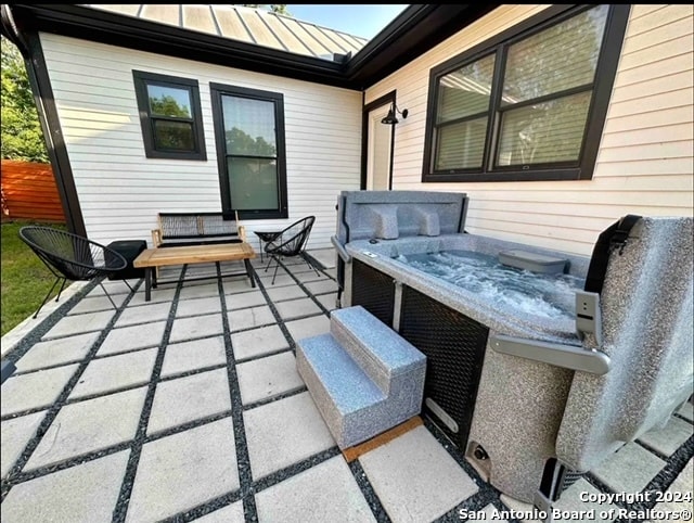 view of patio with a hot tub