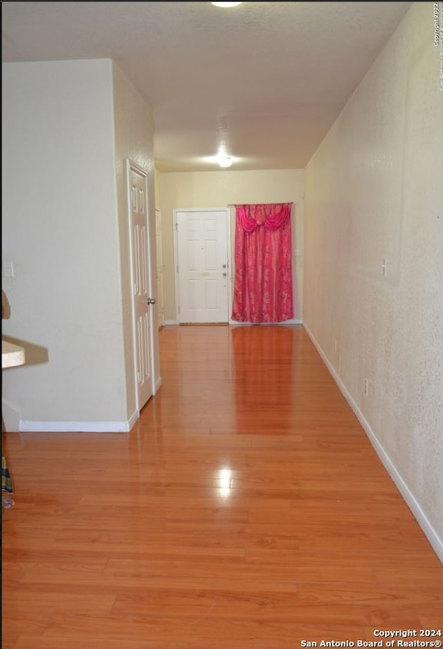 hallway featuring hardwood / wood-style floors