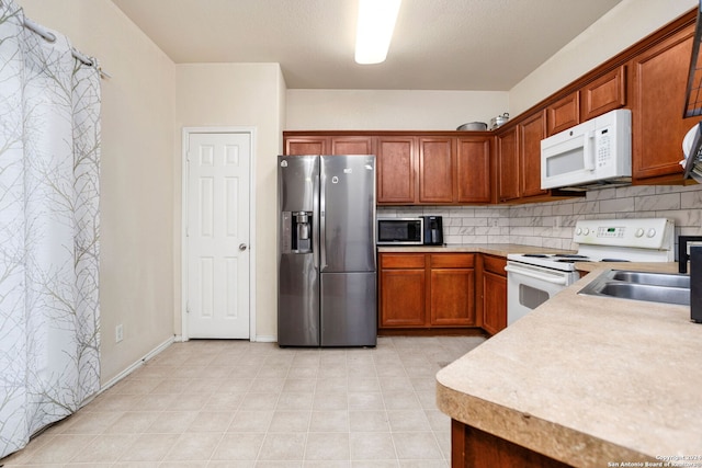 kitchen featuring backsplash and stainless steel appliances