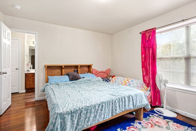 bedroom featuring dark hardwood / wood-style flooring