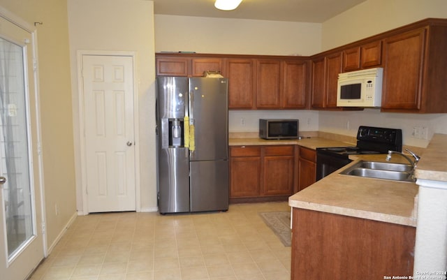 kitchen with appliances with stainless steel finishes and sink