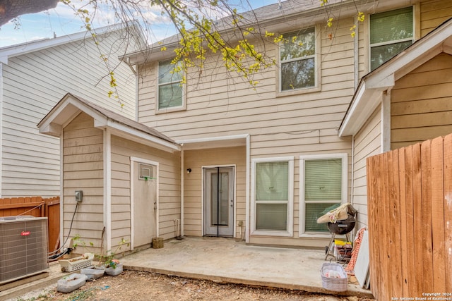 back of house with a patio and central AC