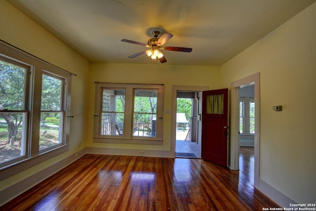 interior space featuring ceiling fan and dark hardwood / wood-style flooring