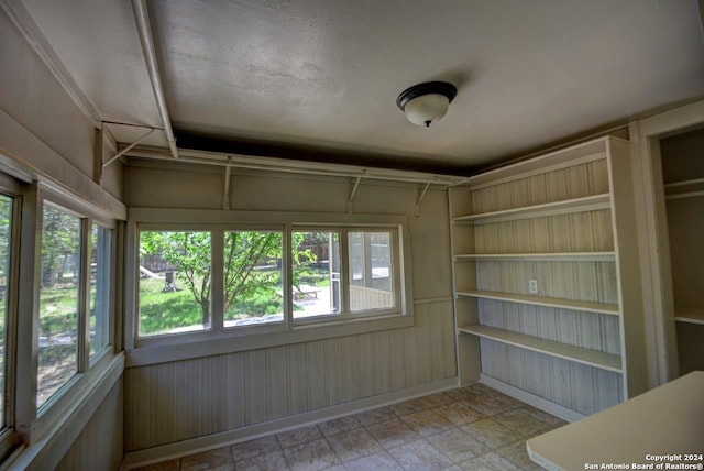 unfurnished sunroom with a healthy amount of sunlight