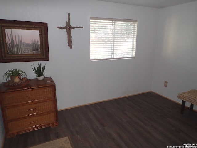 unfurnished room with dark hardwood / wood-style floors